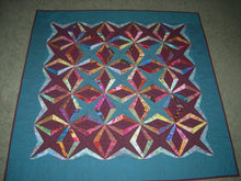 Grandmother's Jumping Jacks quilt pattern available at JackSquaresStudio.com