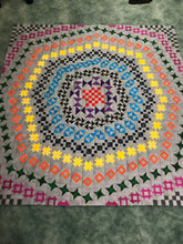 63x63 Frisson Quilt from Jack Squares Studio grey background with brights